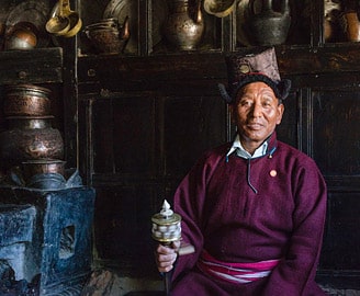Ladakhi man with prayer wheel, Leh