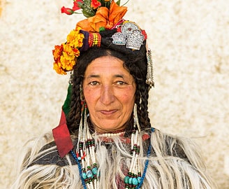 Brokpa (or Drokpa) woman in traditional dress and headdress, Dha-Hanu, Ladakh