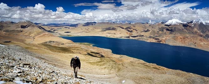 Trekker hiking above Tso Moriri Lake, Ladakh