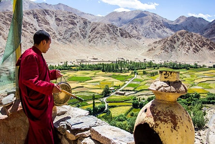 Monk on the roof of Chemrey Monastery, Ladakh