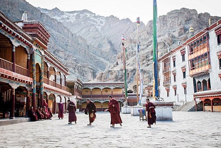 Monks in the courtyard of Hemis Monastery, Ladakh